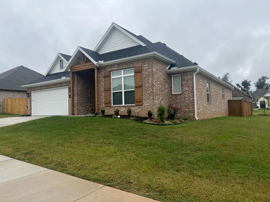 Absolutely gorgeous all brick home sitting on a manucured corner lot. As you open your new front door you're greeted by fresh modern, bright colors throughout.  The light wood floors with the entire back wall of windows cascading natural light throughout the home gives you the feel of being at the beach. As you enter you will be greetd by a large living room with tall ceilings and a floor to ceiling brick corner fireplace. The open floor plan leads to a completely white washed kitchen that you will make you want to cook at home! The huge island with storage under the white granite top is the perfect place for family and friends to gather. Stainless appliances and lots of cabinets allow plenty of space for everything. The primary bedroom has wood beamed cathedral ceilings with ensuite featuring dual vanities, tiled shower, Jacuzzi and walk-in closet. Two more good sized bedrooms perfect for the kids. Private laundry room keeps your mess hidden away. Covered back porch and fenced backyard keep dogs and kids safe.