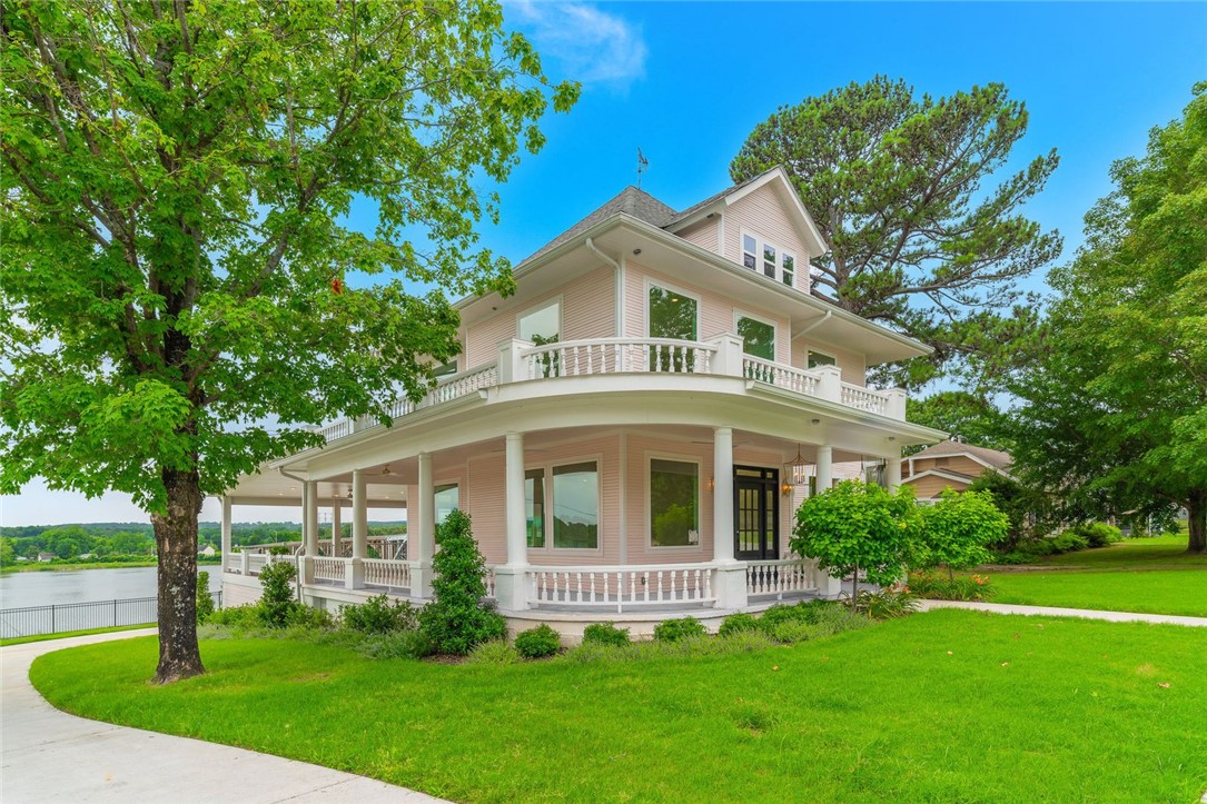 Perched high above the Arkansas River this beautifully restored 3,800 sq.ft. historic home offers some of the most breathtaking views in the Arkansas River Valley. Built in 1926 &  completely remodeled, every area has been tastefully updated with new plumbing, wiring, & high-end finishes while preserving the timeless character.
Designed for entertaining, the home features an easy flow from the front entry through expansive open living spaces to the oversized rear veranda, where sweeping river, bridge, & sunset views create an unforgettable backdrop. Large windows throughout the home capture the beauty of the river from nearly every angle, filling the home with natural light & spectacular scenery.
Rich in local history, the attic once housed the ferry captain who ran the river ferry operation. Cozy nooks, private spaces, delicate touches of pink, 2 laundry rooms, & spacious living areas provide comfort & charm throughout.
Located about an hour from Fayetteville, centrally positioned between Little Rock & OKC.