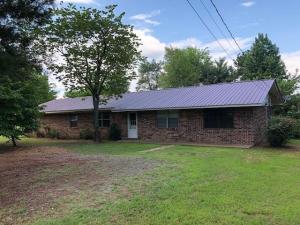 Nice Home offered with 6 acres of land with stocked pond. Bring your fishing gear and all you will have to do is walk out the back door to your favorite fishing hole. 4 bedrooms and 2 and a half bath home with Jacuzzi tub, Attic Fan, and all stainless steel Appliances convey. WITHIN WALKING DISTANCE OF DOLLAR GENERAL!