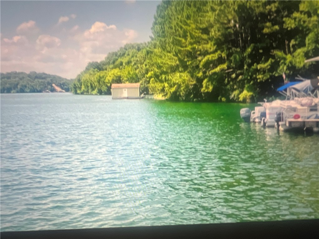 Looking for a place to put your Mobile Home, Pod Home?  This lot has Water, Sewer AND Electric at the street. Starlight Trail across the street. Lake Views at the end of the street.  Eureka Springs 4 miles away! The Holiday Island Marina rests in the serine mouth of Table Rock Lake less than 2 miles away!  A no-wake Kayak and Paddle Board Cove, Sandy Beach Swim Hole, 2 Golf Courses, 2 Swimming Pools, Stunning views!!!! Eureka Springs Schools with bus pick-up. With the utilities at the street This LOT is perfect for you to have an affordable home!  And it's in a resort Community that's amenity rich.  37 miles from Rogers, 4 miles from Eureka, 1 mile to Missouri, 15 minutes away from the beautiful Roaring River State Park (Trout Fishing!) and the famous Blue Hole.  Holiday Island is in the heart of the Ozarks and incredibly charming.  So much to do and explore thats just naturally occurring, without spending a dime!  Property backs up to no-man's land so property feels larger than .58 acres!