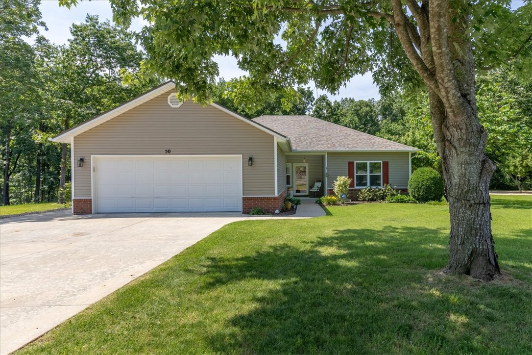 Welcome home to this meticulously maintained single-level retreat nestled on a rare flat lot in a private cul-de-sac surrounded by lush landscaping, fruit trees, berry bushes, and garden spaces. Beautiful wood flooring, crown molding, a cozy fireplace, and a wood burning stove create warm, inviting living areas. Offering 2 bedrooms plus a spacious bonus room or office with access to a screened porch overlooking the peaceful backyard. The kitchen features all newer appliances and abundant cabinet and counter space, while the remodeled primary suite includes an updated bath and custom closet. Extensive upgrades throughout, including a top line Trane Dual Fuel HVAC and a 22-kw whole house generator, provide peace of mind. Please see the amenities list for a complete overview.