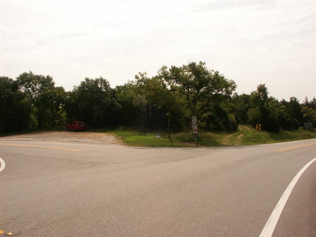 Excellent high-traffic location on a busy intersection! Almost 12 acres of wooded land on Highway 62 and Highway 187. This property could also have a nice view of the White River valley. Only a few minutes drive from the White River and Beaver Lake and roughly 15 minutes from Eureka Springs!
