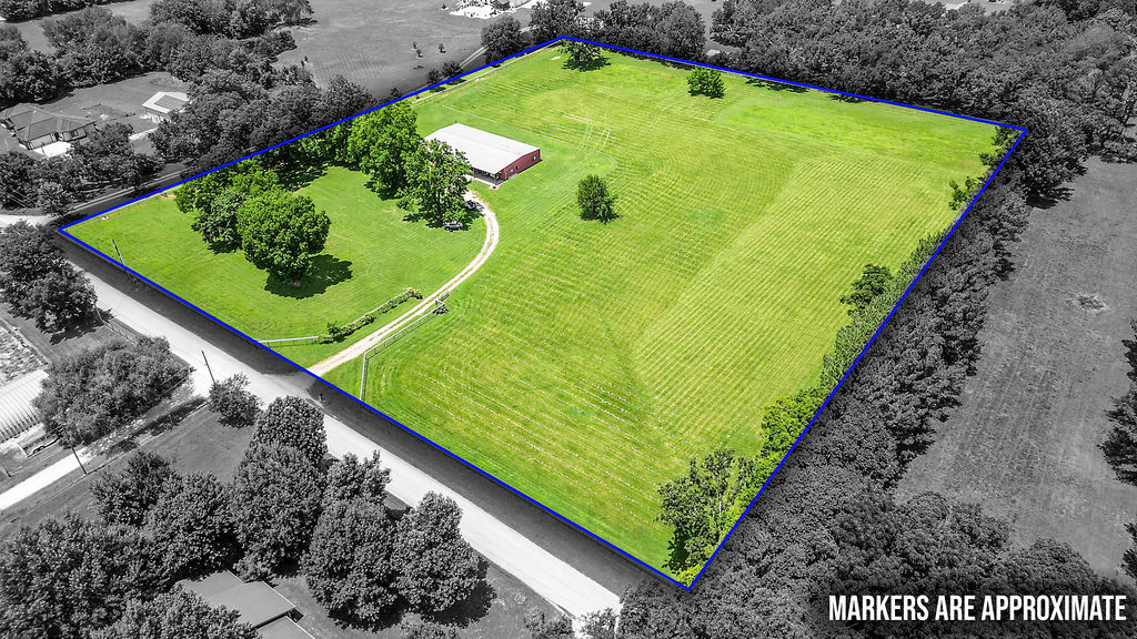 Discover the perfect blend of country living and convenience on this beautiful 8.5-acre property located just minutes from downtown Bentonville and downtown Rogers. Fully fenced with 6-foot horse fencing, this versatile property is ideal for horses, hobby farming, or simply enjoying wide-open space. The impressive red iron building features approximately 3,500 sq. ft. of open shop space, perfect for a workshop, business, or storage, along with 1,500 sq. ft. of living space. Mature pecan, walnut trees, 20 year old fig tree along with established grapevines, add charm and character to the acreage. Whether you're looking for a live-work opportunity, a primary residence with room to roam, or the perfect spot to build your dream home next to the existing structure, the possibilities are endless. Enjoy the peace of country living with all the shopping, dining, and entertainment Northwest Arkansas has to offer just a short drive away.