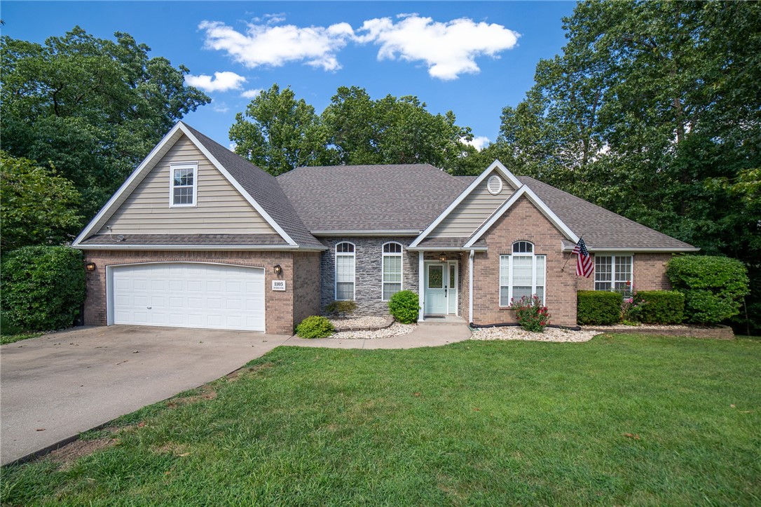 This beautiful Rogers home sits on just over an acre lot, surrounded by trees, hills, and all of the beauty you'd expect from NWA! Many updates have been done including a new roof in 2018, new water heater, flooring, deck, appliances in kitchen, sound system in the garage, and wiring for a generator. You'll find four generously sized bedrooms, three of which have walk-in closets. The living room is sure to charm you with the built-ins, fireplace, and french doors that lead to the gorgeous sunroom, and you'll enjoy even more space with the designated office (featuring a fireplace and cathedral ceilings), and the formal dining room. HUGE crawl space for storage! Outdoors there is ample room to spread out and enjoy a night around the firepit. As always, location is key; and this gem is only 7 minutes to downtown Rogers and Beaver Lake, and 5 minutes to Lake Atalanta.