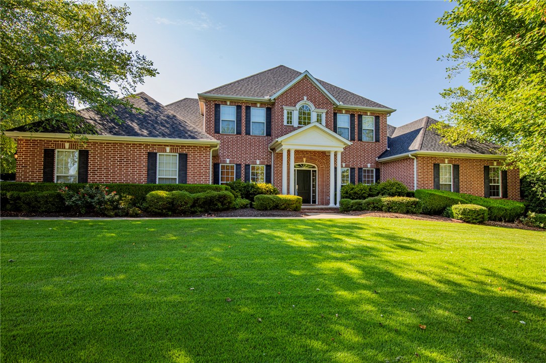 Serenity awaits you with this solid colonial style home in the premier Pinnacle Country Club. Built in 2003, the home sits on a meticulously sculpted .83 acre lot. Find reprieve from the heat in the pool, or by the koi pond under the mature trees. The privacy this estate offers will make you forget it's located right in the heart of NWA. With over 4000 sq ft, 5 bedrooms, 3 full and 2-half baths and a media room, there is ample space for the whole family to enjoy. The formal dining, large open kitchen and living area give you the space to entertain in style. Experience the tranquility using the the sun room or back deck off the master suite. Come and find your bliss in Pinnacle.