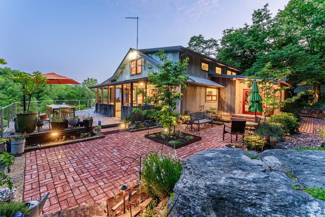 Not even your wildest dream’s dream could create a place so magical. This 1930s farmhouse has been fully-restored and expanded to bring in modern luxuries. The end result is a refined-rustic vibe all its own. Every inch, every tiny detail of this property's revival was completed with intention. These guys were painting with the smallest brushes, folks. I wouldn't be surprised if they mowed the lawn with scissors. Everything is just perfect, from the extensive landscaping that merges with the natural formations, the cedar-fenced garden, and a spring that feeds what might be best little fishing pond ever. Outside is most certainly THE place to be, but inside, man ... the spectacular kitchen and pantry, the coziest, coolest main living and dining areas, a primary bathroom you'll never want to leave, the flexible upstairs area that you will find the perfect use for. Add to all of that the detached RV storage garage, the wood-working/garden shed, and the easy 25 min drive to town, it's not only perfect, but practical.