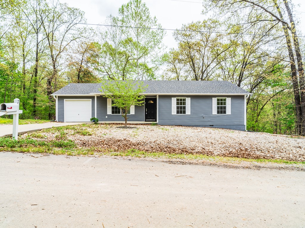 A secluded 3 bedroom, 2 bath, 1 car garage home. This house has wood flooring in main areas, open living & kitchen area, double doors leading to back deck with an overlook of nature. All electric. 1 pet negotiable with increased rent and deposit. Call to view!