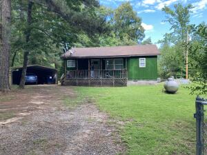 Fisherman's getaway! Located next to lake Atkins, in the Lucky Landing Subdivision, and just a short walk to the boat ramp.  Don't miss this opportunity to own your very own cabin by the lake. This cabin offers 2 bedrooms and 1 bath, with 3 lots, a pond, a storm shelter, a metal carport, and a Ring Security System.  Freshly updated with all new AC unit, new breaker box,  and new breakers.  Call today to setup your showing.