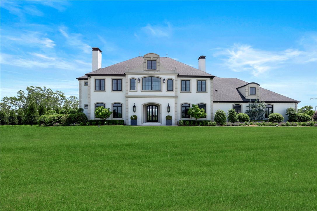 Located in the gated Waterford Estates community where an abundance of catch-and-release ponds and park-like common areas are peppered throughout, it’s easy to forget that you’re only ten minutes from town. This sprawling estate on Riverfront Lane lives up to its address, offering a front-seat view of the changing seasons across the White River and Boston Mountains. A flawless take on the open-concept; space, light, and flow are perfected in the home’s central area which connects lounging, dining, and entertaining. Double islands feature in the grand eat-in kitchen with highly customized cabinetry and commercial grade appliances. No detail was overlooked in the outdoor living area with heated pool and retractable cover, fire pit, outdoor kitchen, fireplace, and dining. Considerate architectural design provides large closets, ensuite baths, and luxurious amenities to every bedroom. Exceedingly functional spaces include built-in safe room, 4 car garage, walk-in pantry & mud rooms. Inquire for a full list of features.