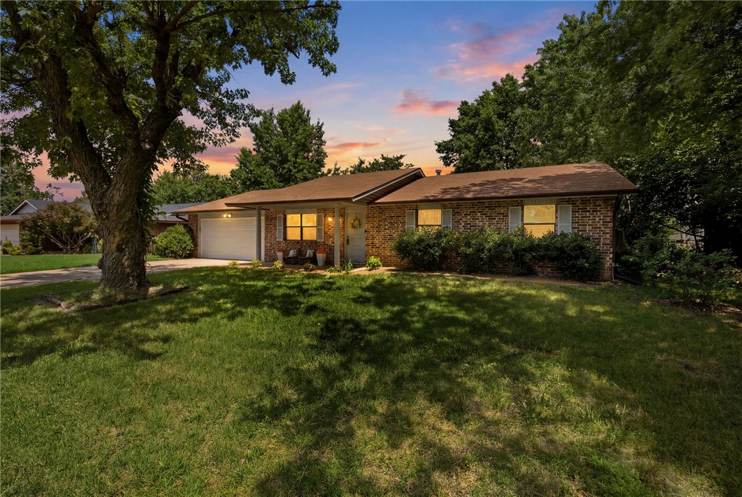 Conveniently located just minutes from I-49, this 3-bedroom, 2-bath home offers easy access to everything Northwest Arkansas has to offer. The four-sided brick exterior provides lasting curb appeal, while the covered front porch is a great place to relax. Inside, you’ll find laminate flooring throughout with no carpet, a spacious living room with a fireplace, and a large kitchen featuring plenty of cabinet storage. The refrigerator, washer, and dryer all convey with the home, making move-in even easier. The oversized garage includes a built-in workshop area, and the backyard features an additional storage/workshop building, providing plenty of space for projects, tools, or extra storage. The large backyard offers room to enjoy the outdoors, garden, or entertain.

With practical features, generous storage, and a convenient location, this home is ready for its next owner.