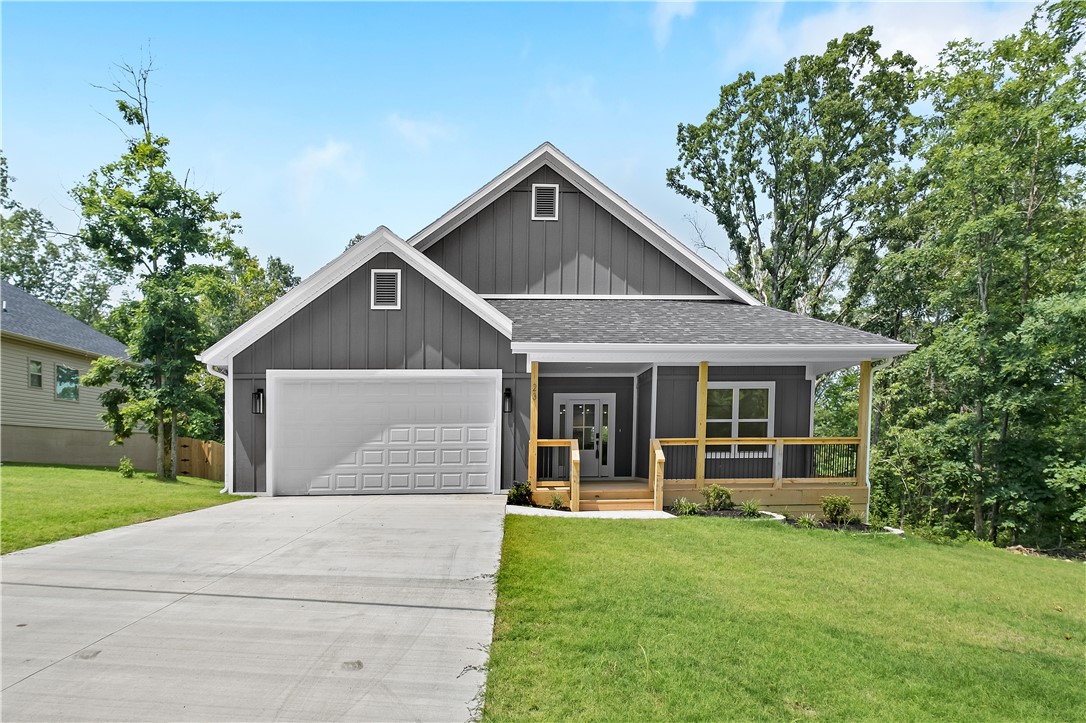 Modern design meets timeless comfort... with the addition of a second lot giving you over 3/4 of an acre to spread out and call home. 

This beautifully crafted custom home offers a blend of style, function, and relaxation. Step inside to find luxury vinyl flooring throughout, a striking shiplap fireplace, and textured brushed granite countertops with a sleek, full-height backsplash. The kitchen features upgraded Samsung appliances and a spacious walk-in pantry—ideal for home chefs and entertainers alike.

Expansive picture windows flood the space with natural light, while the oversized front porch and back deck provide inviting spots to unwind or host friends. Each bedroom includes a generous walk-in closet, and both bathrooms showcase spa-inspired custom showers.

Whether you’re a young professional looking for a refined retreat or ready to enjoy a low-maintenance, high-quality lifestyle in retirement, this home offers the best of both worlds.

Schedule your private tour today—you won’t want to miss it!