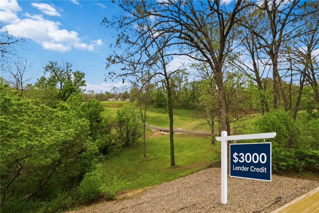 Premier golf-course living on a rare double lot overlooking the 15th tee of Highlands Golf Course! This 3,342 sq ft home features 4 beds, an office, and 2 living areas. The main level offers an elegant dining space, an eat-in kitchen with a propane fireplace, and a heated/cooled sunroom with oversized windows. The lower level includes a second living space with a wet bar.

Outside, enjoy a large garage workshop, a 12'x20' double-door shed, and a new architectural roof. Located minutes from the Bella Vista Bypass, Branchwood Rec Center, Loch Lomond, and the fire station. Priced below appraisal! Get a $3,000 buyer credit at closing when using Seller’s preferred lender.