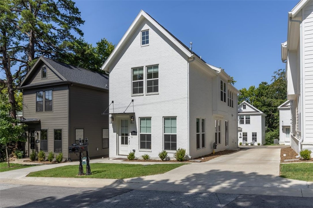 Rare opportunity to own not one, but 2 homes just off the Fayetteville Square!! Property is a 1768 sq ft, 3 bed, 2.5 bath home in front with a detached 1200 square ft. 2 bed, 2.5 ADU in back. Walking distance to The Square, Farmers Market, Dickson St, Walton Arts center, state of the art Public Library, shopping, coffee shops, and several Fayetteville staple restaurants including Hugo's, Feed & Folly, Cheers, Atlas, Tula, Vetro 1925, Taste of Thai, Tiny Tim's Pizza and several more! Easy bike or commute to the University of Arkansas, Razorback Stadium, Bud Walton Arena (The Basketball Palace of Mid-America) & Baum Walker. Both homes feature Hardwood Floors throughout, quartz counter tops, gas range, open layout, low E Windows, and so much more! Don't miss out on this rare opportunity to own 2 amazing homes right in the middle of Downtown Fayetteville! Perfect opportunity to live in one, a rent out the other.