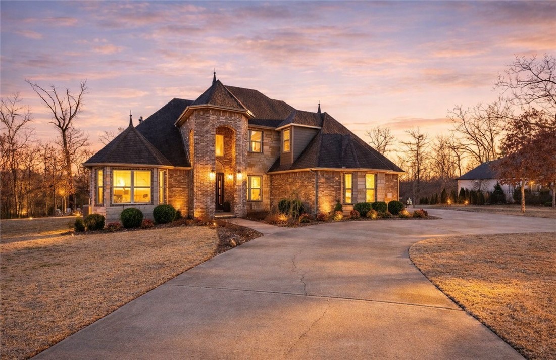 The best land + home value in this price range in NWA! Offered for the first time ever, this one-owner estate sits on one of the largest and most coveted homesites in Versailles—an exceptional 2.75 acres of privacy and space. This 5-bedroom, 4-bath residence features a thoughtful layout with two spacious living areas and a versatile bonus room (with wet bar) ideal for media, play, or work-from-home flexibility. The beautifully renovated chef’s kitchen serves as the heart of the home, showcasing premium finishes, generous prep space, and seamless flow into the main living areas—perfect for gathering and entertaining. Expansive windows invite natural light and frame serene views of the surrounding acreage. The primary suite offers a peaceful retreat, while additional bedrooms provide comfort for family and guests. Rarely does an opportunity arise to own one of the largest lots in Versailles, with ample room to add a pool, shop, or custom outdoor oasis.