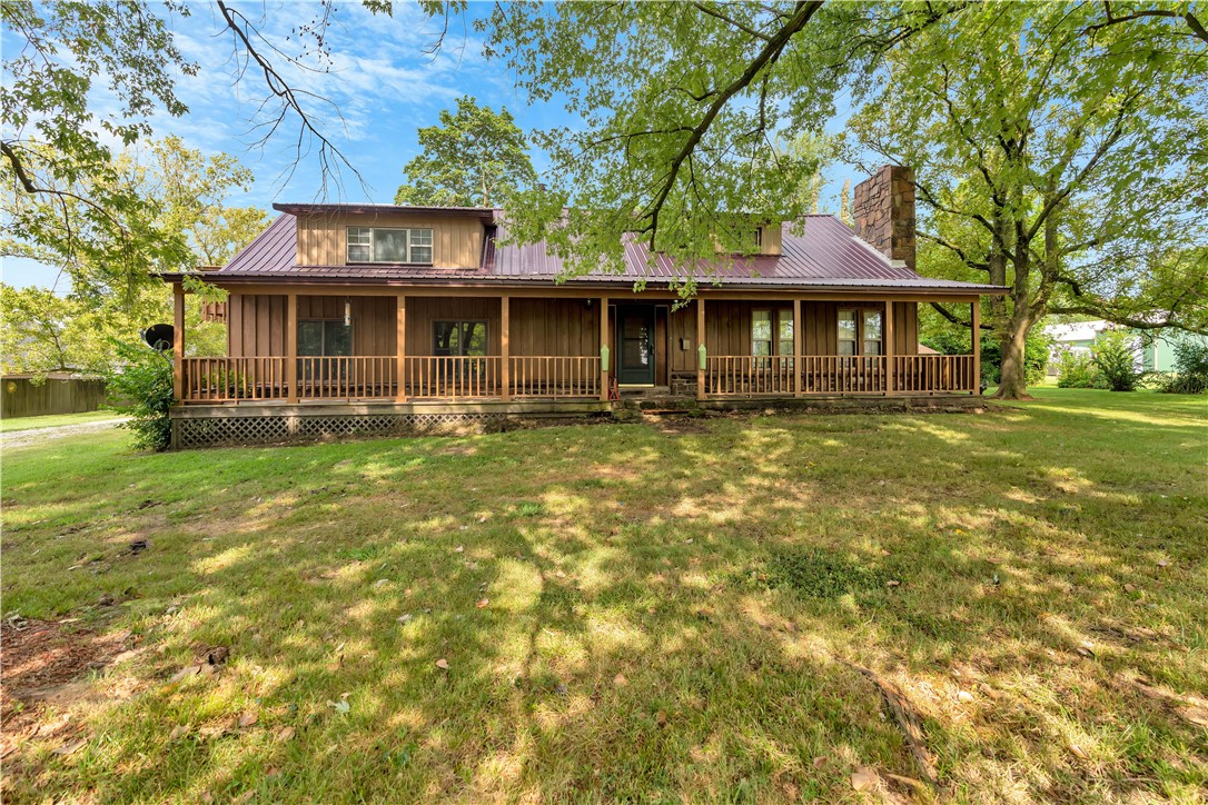 A turn of the century home that was remodeled in 2002. Lots of room and lots of options to make it your own. Hard to find 1 acre lot in town. Large covered front porch with huge shade trees in front. Big screened in porch on back of house. This can be a special place with a little imagination. SOLD AS IS. Close to schools and public park with walking trail. Two storage or shop buildings. Additional 375 sq ft partially finished heated & cooled room. Not included in heated sq footage.