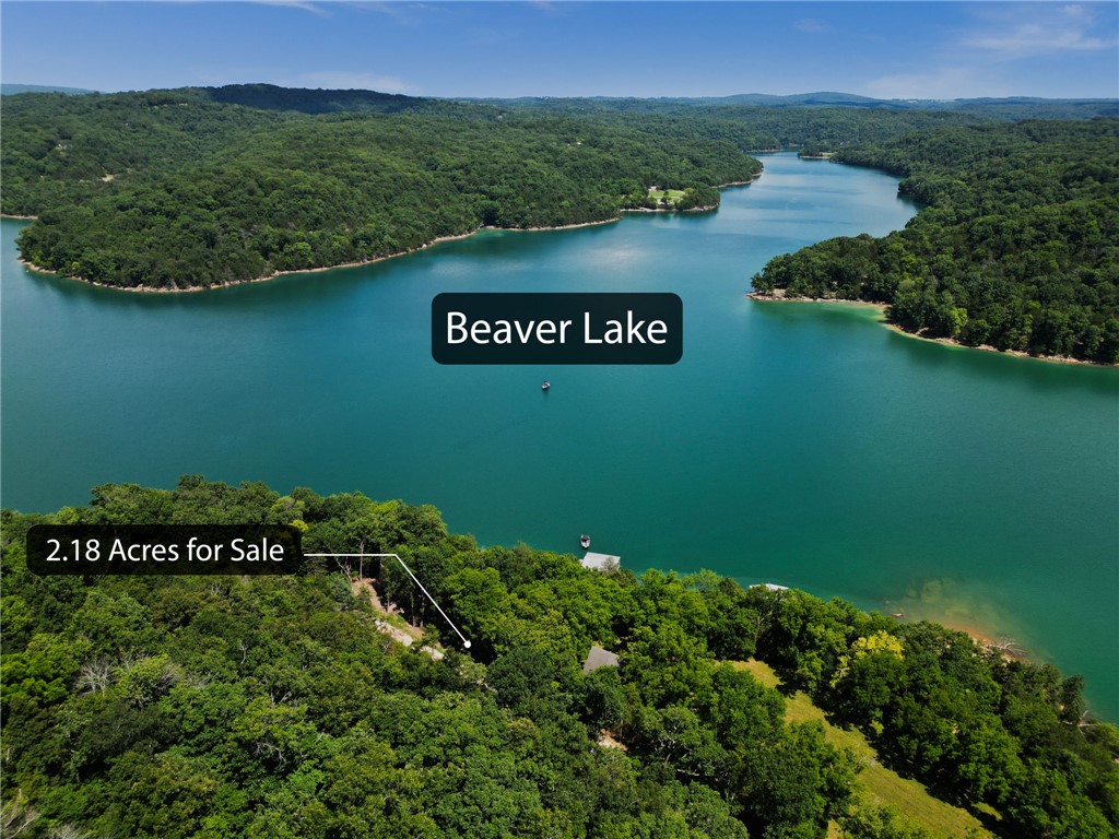 Build the Beaver Lake getaway you've been envisioning on this beautiful 2.18-acre lakefront parcel at the end of Angell Road. With selective clearing, the property offers the opportunity to capture scenic lake views while maintaining the privacy and natural beauty of its wooded setting. Enjoy direct access to the shoreline from both your parcel and the public, Corps boat launch (gravel) located just seconds away, making it incredibly convenient to launch your small watercraft, kayaks, or paddle boards whenever the water calls. Rural water is available at the road, providing a major advantage as you plan your future home. A septic system will be required. Whether you're dreaming of a full-time residence, a vacation retreat, or simply securing your own slice of Beaver Lake for the future, this property offers an outstanding combination of privacy, water access, recreational convenience, and building potential in Beaver Lake's famed Big Clifty Creek...home to the waterfalls of Hogscald Hollow and Penitentiary Hollow.