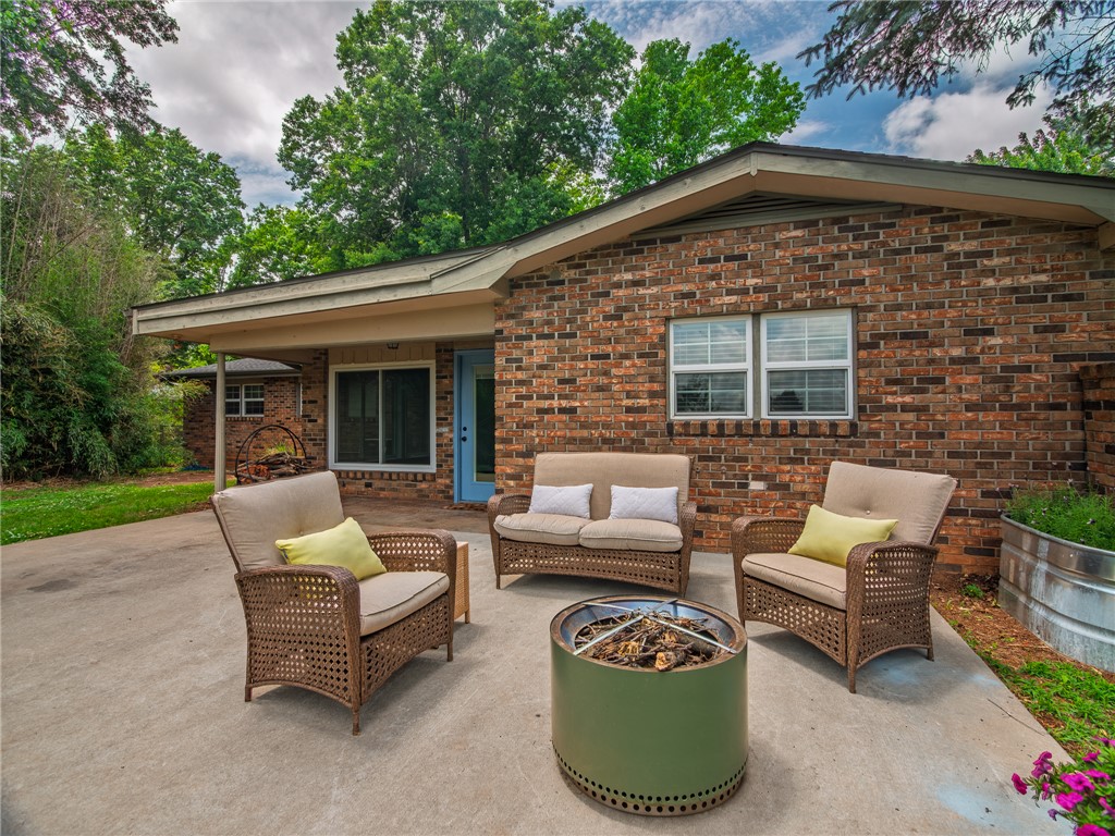 This beautifully renovated home offers direct easement access to Gulley Park. Enjoy the biking trails, splash pad & Summer Concert Series right from your backyard! Every major system has been replaced, including the roof (2020), HVAC (2024), hot water heater (2025), and new gutters (2025). Real hardwood floors, updated kitchen & bathrooms, and a sunroom with energy-efficient windows + crawl space encapsulation completed in (2025). Large, private yard, minutes to downtown Fayetteville, the Square, U of A, and interstate access, all within the Butterfield Elementary district!