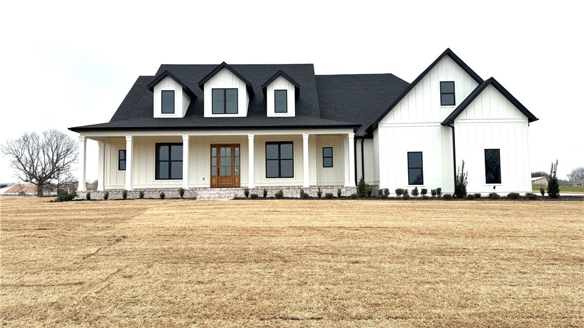 Luxury and Location! Stunning new construction home right near the new by-pass exit on 412!  Sitting on 1.36 acres in Tontitown, this beautiful property offers 5 bedrooms plus a sophisticated office, 4.5 baths, and 3,784 sq ft of thoughtfully designed living space! This corner-lot home features an open layout with a vaulted living room ceiling accented by poplar beams, an elegant 18’ foyer, and wood and tile flooring. The gourmet kitchen includes 10’ full-height custom cabinets, a natural gas range, large island, and a GENEROUS butler’s pantry with an extra sink and fridge space, in addition to more cabinets and shelves. The primary suite offers a large soaking tub, tile shower, his/her vanities, and a large walk-in closet with added storage that is connected to the spacious laundry. Upstairs provides a bonus room with it’s own full bath and large closet! Covered front and back porches make taking in the beautiful surroundings a breeze. Come see where convenience and luxury living meet!