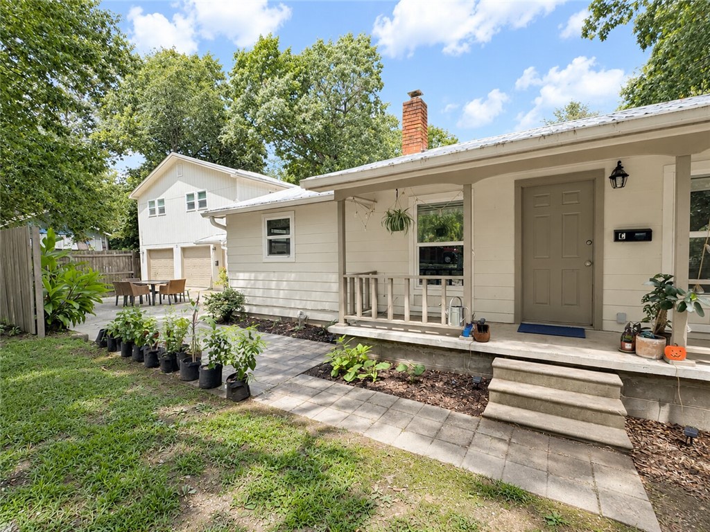 Rare opportunity to own a beautifully remodeled 4-unit investment property that may qualify for residential financing! Live in one unit and let the other three help offset your mortgage, or lease all four for strong income potential. This private 1.5 acre property sits at the end of a quiet road, bordered by woods on three sides and a privacy fence on the third. Each unit features updated finishes, luxury vinyl/tile flooring, private deck or patio, and its own unique layout. Tenants enjoy a shared outdoor gathering area, large circular drive, and peaceful setting. Current rents total $4,650/month currently below market rates. Attached 2-car garage and 10x12 storage building are currently owner occupied but have generated tenant interest as potential additional income. Metal roof, septic with grinder pump to city sewer, Prairie Grove School District and Washington County water complete this exceptional investment.