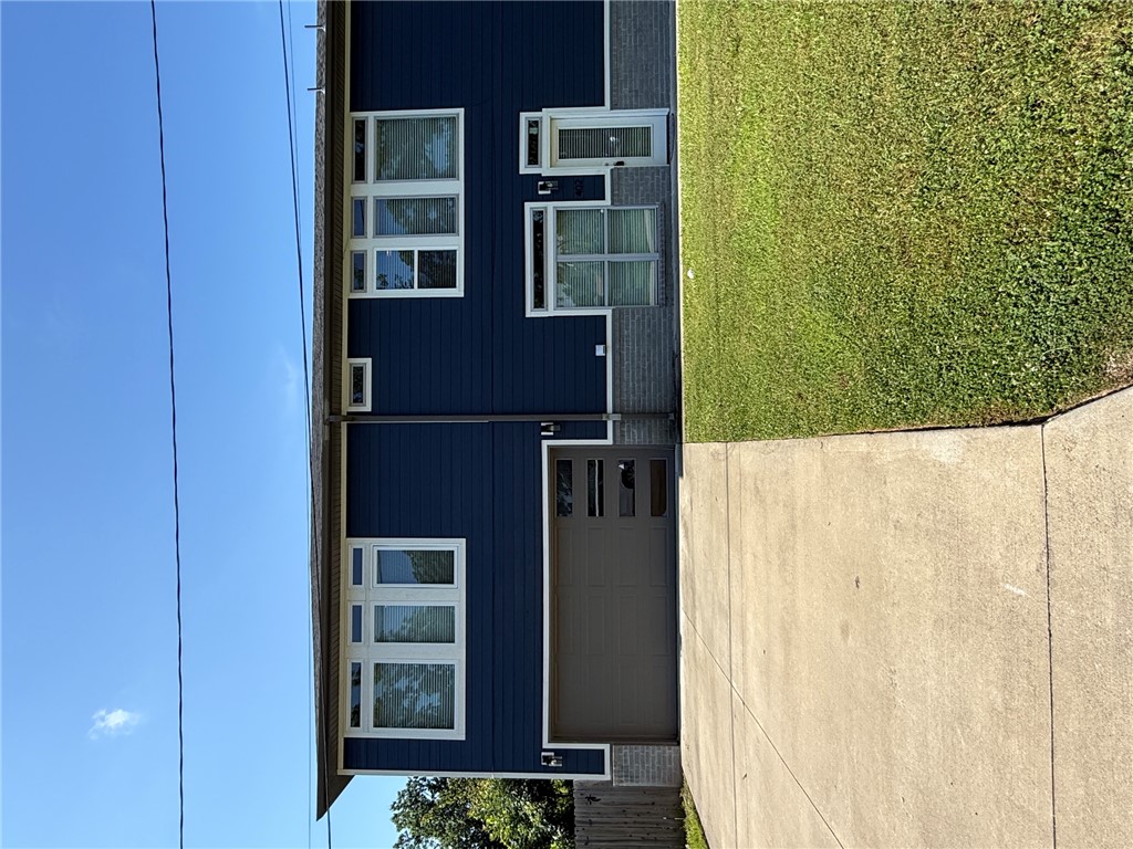 2 bedroom 2 bath duplex a stones throw from Lake Atlanta, and few steps from thriving Downtown Rogers. Interior includes spacious living room and kitchen with stainless appliances, easy-care flooring and modern/urban accents. Two bedrooms with full baths complete the upstairs. Two-car garage and small fenced backyard. Available Now! Apply at PrimeNWA.com