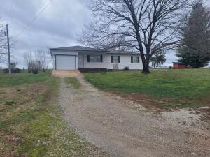 You don't want to miss this well maintained 3 Bedroom, 1 1/2 Bath home with a one car garage. Conveniently close to town without the restrictions. There is plenty of room to build a shop. Move in ready with updates which include; Well pump and piping replaced in 2008, Sunroom completed in 2010, Roof replaced in 2015, Main Bathroom remodeled in 2020, HVAC and water heater replaced in 2021.Agent Owned.