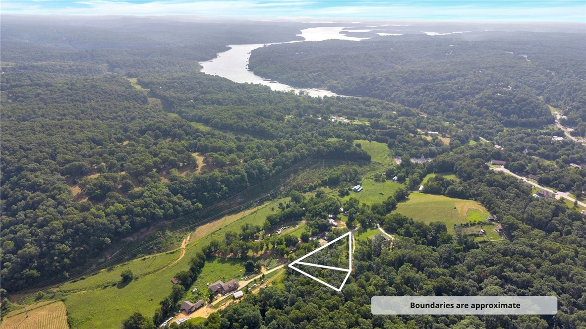 1 acre to built a house, close to downtown Rogers. Buyer to verify all information.