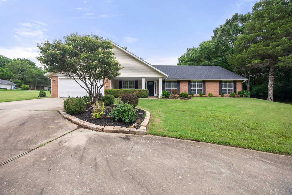 East Fayetteville living with room to grow. This 4-bedroom, 3-bath home offers approximately 2,422 square feet on a single level, including two primary suites for flexible living. The open living room, separate den/office, dining room, and eat-in kitchen with generous breakfast nook create multiple options for everyday life and entertaining. Recent updates include new flooring throughout and an updated kitchen with quartz countertops. A new roof was installed within the last two years and the HVAC system within the last three, and the home was recently pre-inspected in preparation for market for added peace of mind. Set on a 0.48-acre lot, the expansive side yard offers room for gardening, play, or potential future improvements such as an ADU (buyer to verify). Tucked into a quiet pocket of the established Royal Oaks Estates, conveniently located near Gulley Park, trails, dining, and East Fayetteville favorites, all within the Root Elementary district with school bus pickup at the end of the street. Must see!