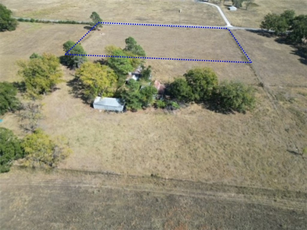 Discover the perfect canvas for your dream home or agricultural venture with this picturesque 5-acre tract of level pastureland.  Nestled along a well-maintained paved road, this property offers easy access and convenience, making it ideal for a variety of uses.  The property benefits from reliable rural water access right at the street, ensuring you have the necessary resources for farming, gardening, or simply enjoying the natural surroundings.  Whether you're looking to build your forever home, establish a small farm, or create a recreational retreat, this 5-acre property is a rare opportunity that combines accessibility with the beauty of the countryside.
