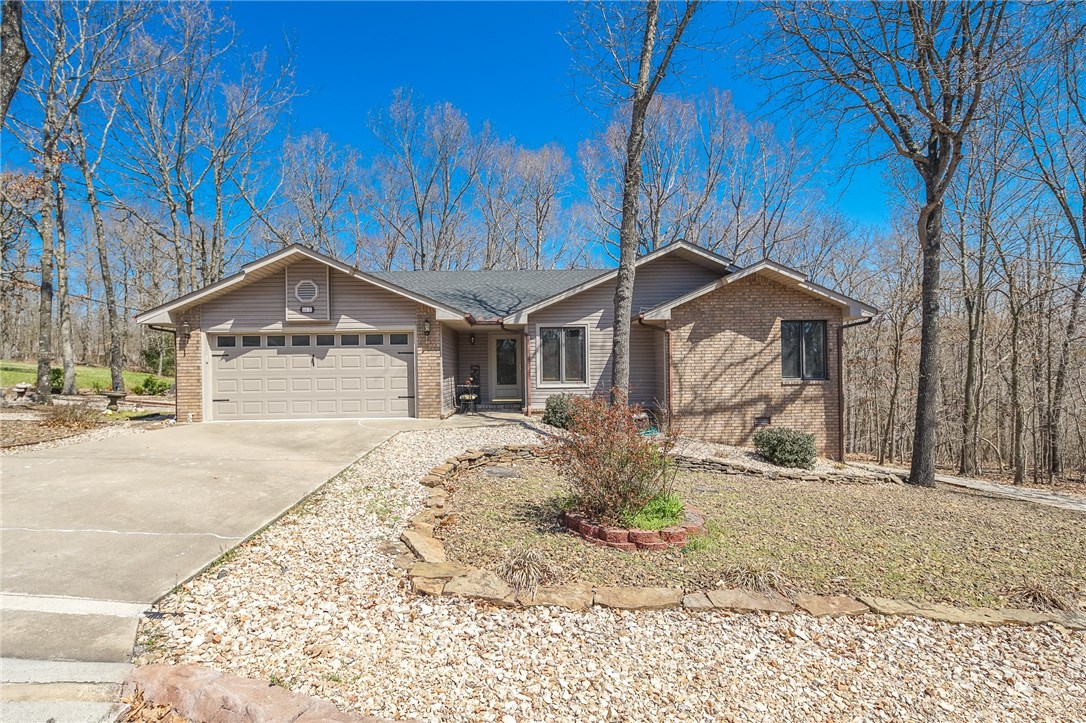 Cute home on a large lot and secluded with beautiful mature trees. Large living room with vaulted ceiling, wood flooring, gas log fireplace with rock wall, and built-in shelving/cabinets. Spacious open kitchen has granite counters, breakfast nook, pantry and plenty of cabinet space. Carpet in bedrooms. Large master with walk-in shower, updated counter & sink and walk-in closet. Huge all-season room fully surrounded with windows and great for 2nd living space or entertaining. Tons of storage space! Great backyard space with nice landscaping. Come see this cute home before it's gone!