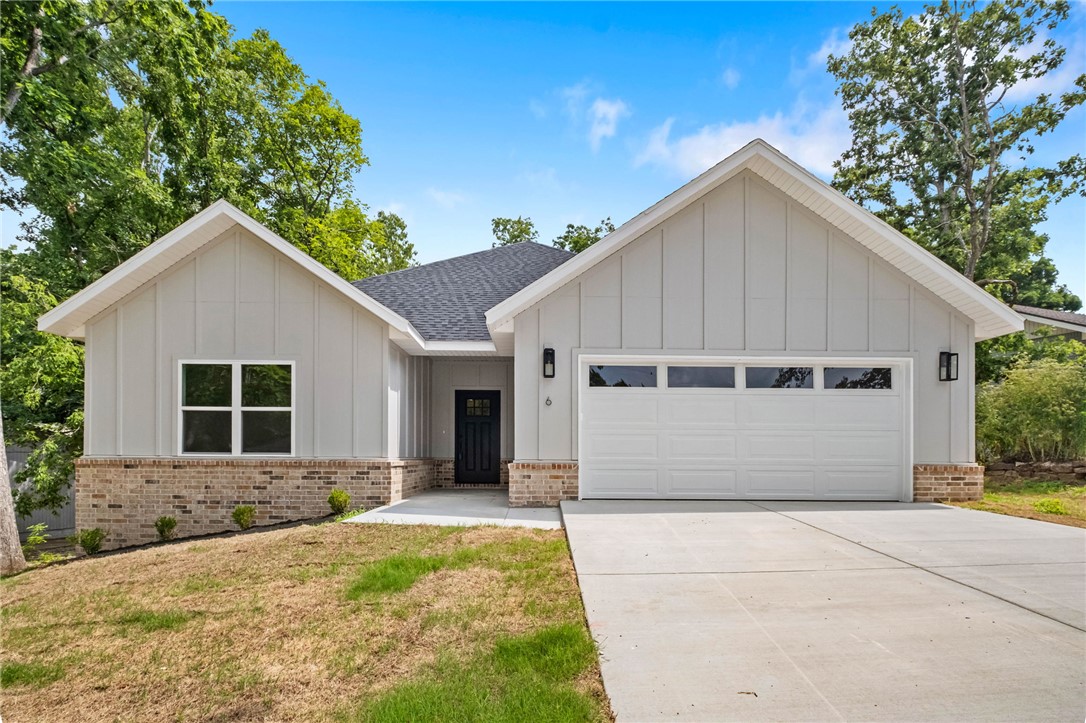 New construction on a .33 acre wooded lot right next to Branchwood Recreation and Nature Trail! Also located within close proximity to Highlands Golf Course, Lake Loch Lomond, and I-49. Step inside to discover an inviting open concept design featuring 10’ ceilings and beautiful floors that enhance the spacious feel of the home. The stylish kitchen is equipped with a gas range, 3 cm quartz countertops, custom cabinets, and a walk-in pantry. Entertain or unwind in the living area, complete with a stunning fireplace, or step out onto the covered patio to enjoy the peaceful surroundings. The primary suite features a massive walk-in tile shower and closet. 2 bedrooms + office. Buyer can also receive $3,500 in closing costs when using the builder's preferred lender!  100% financing (no down payment) is available as this property is eligible for Rural Development Financing.