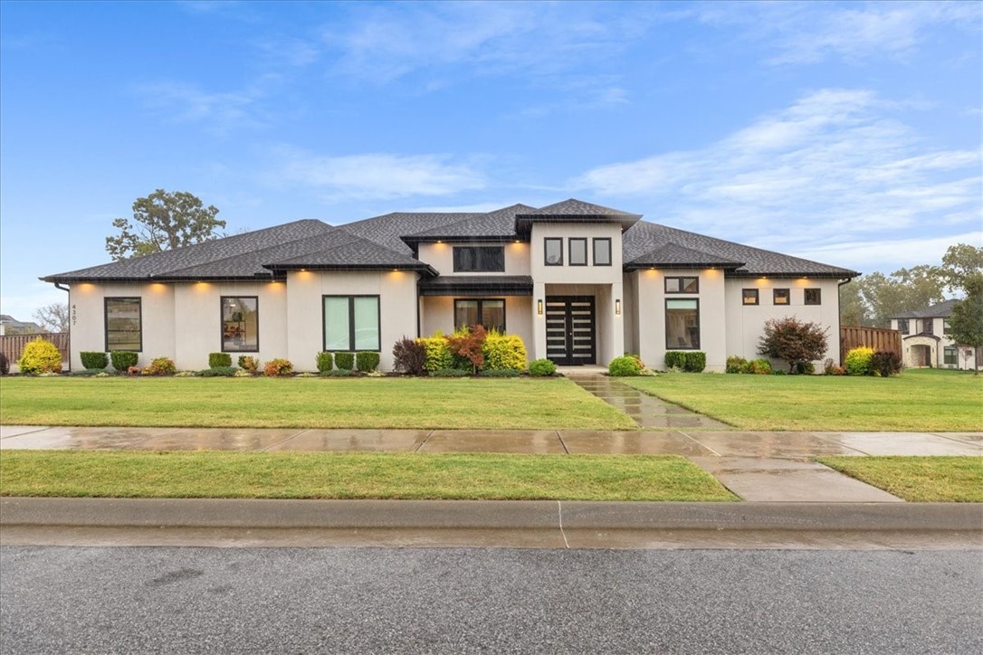 Luxury and function meet in this David Harris custom home in Scissortail. Offering 3,636 sq ft of modern one-level living on a corner lot, this home features 5 bedrooms and 4 baths, with the fifth serving as a state-of-the-art media room with projector and surround sound. The private primary wing includes dual custom closets and a dedicated home gym. A chef’s kitchen boasts Bosch appliances, induction range, and quartz countertops, while a spacious office adds flexibility. Enjoy peace of mind with an above-ground storm shelter, whole-home surge protector, smart switches, and Nest doorbell. Thoughtful upgrades include motorized shades, oversized laundry room, and a 16-zone sprinkler system. Experience modern luxury living in Scissortail—schedule your private showing today!