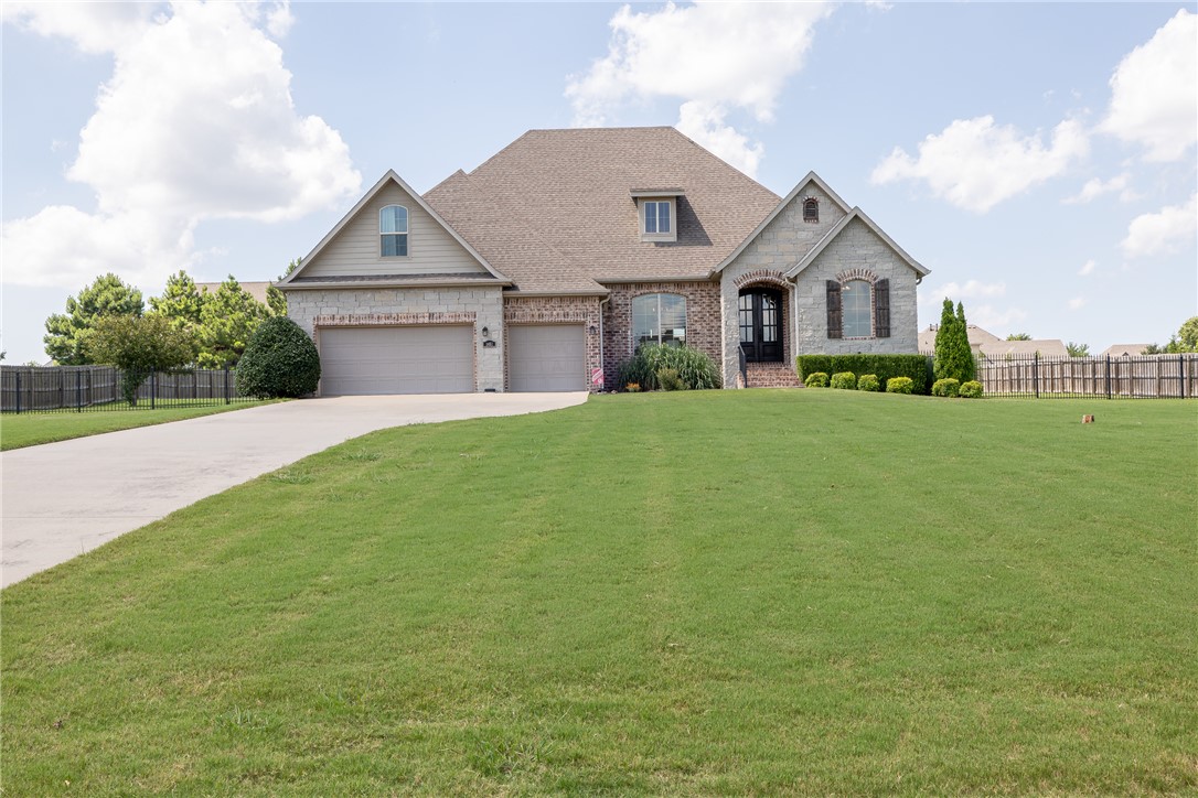 Wonderful home in East Fayetteville’s super desirable Waterford Subdivision. Situated on 0.92 acres this home has 2,974 heated and cooled sq ft and offers 4 bedrooms (of which 3 are on the MAIN LEVEL), 3 full and 1 half bath, study, normal dining, eat in kitchen, living room, and separate laundry. Amenities include hardwood floors, built in’s, granite counter tops, PRIVATE basketball court in backyard, covered patio with a gas log fireplace, fully fenced yard, and a 3 car garage. This home is getting a BRAND NEW ROOF any day now.  The neighborhood is gated and offers a community pool, White River access, a clubhouse, and fishing ponds.  Zoned for Vandergriff and Woodland School too!