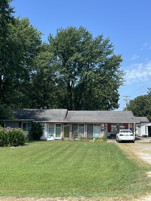 Could be 4 bedrooms with the addition of 2 closets. Large home on 2 acre corner lot. Lots of possibilities here with approximately 2100 feet of shop/garden shed/barn/etc. Home needs TLC and is being sold "AS IS". Room for another house if desired. Perfect spot for crafters, mechanics, or woodworkers.
