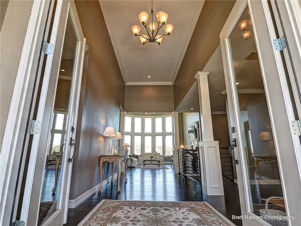 ABSOLUTELY STUNING! from the moment you enter, DESIGNED with Golf Course Views From Every Room but two. Pristinely Remodeled, hardwood floors, granite counters,  THERMADOR Appliances, 6 Burner gas top, Dble. ovens, Granite island w/sink. Living, kitchen, & Dining ideal for Entertaining.  Intimate MSTR. Suite W/FP.  Lower level with den - 9.2 sound system,  3 Bedrooms, 2 bath w/access to one of two covered patios.