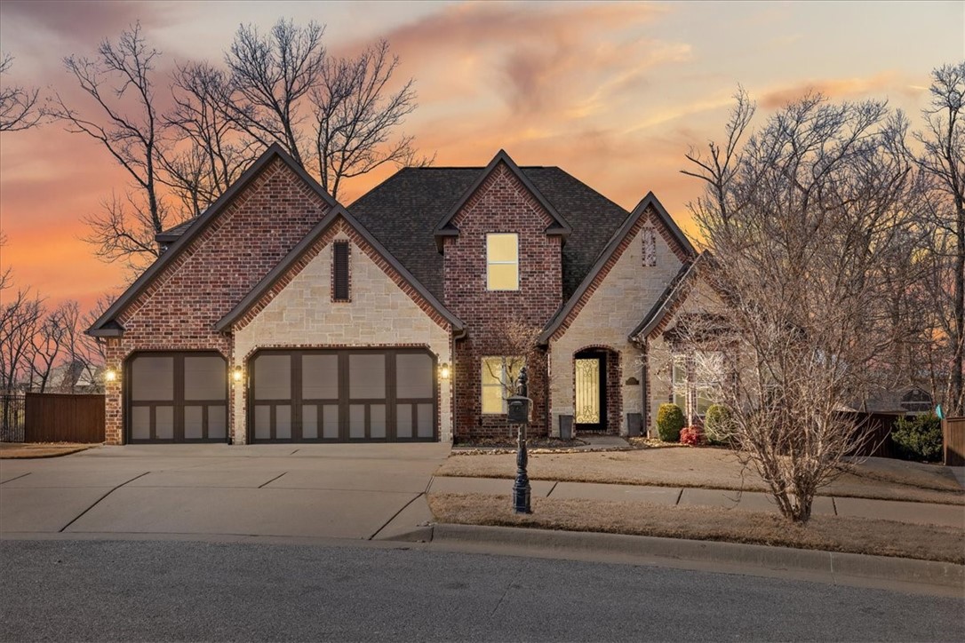 Looking for a house that backs up to woods, has a pool, & bikeable to Walmart HQ Campus? This is it! On over an acre of land, you can relax & enjoy nature as your backdrop while you're laying out by the heated gunite pool. In a cul-de-sac, w/ MTB trails nearby, Downtown Bentonville mins away, & quick access to I-49 this location can't be beat! Main floor features primary suite, 2 bedrooms that share a full bath, office, half bath, dining room, laundry room w/ sink, & mudroom. Primary has access to covered patio, wood floors, soaker tub & shower, & spacious closet. Thoughtfully designed kitchen w/ a generous island, double ovens, gas cooktop w/ vent hood, pantry, & abundant cabinetry. Second floor has one en suite bedroom & addt'l bedroom + full bath. Both BDRs are generously sized & have giant walk-in closets. Media/bonus room is perfect for movie nights! Addt'l features: granite countertops, central vac, 10' ceilings, surround sound, irrigation, & wood floors. OPEN HOUSE FRIDAY 3:30-5:30!