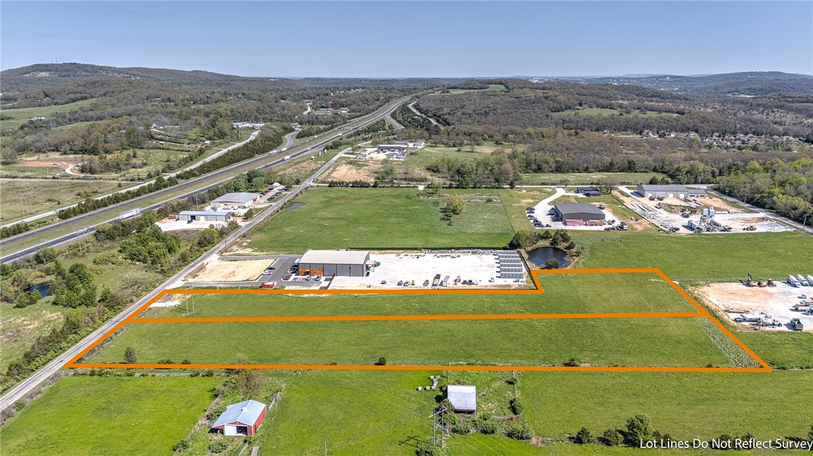 RARE 2.77-ACRE INDUSTRIAL SITE WITH PRIME ROAD FRONTAGE AND I-49 ACCESS IN NWA. Flat, usable land with electric on-site and public water at the street - ideal for industrial, commercial, or mixed-use development in a high-growth market. Located within a highly desirable industrial park, this property offers excellent visibility, efficient access for transportation and logistics, and strong long-term investment potential. Its strategic position allows quick connectivity throughout Northwest Arkansas, making it well-suited for owner-users, developers, or investors seeking flexibility and scalability. With utilities in place and a site that’s ready to build, this opportunity minimizes upfront development hurdles while maximizing future growth. Properties like this are increasingly hard to find in such a prime location - schedule your showing today and secure a foothold in one of the region’s most rapidly expanding corridors.