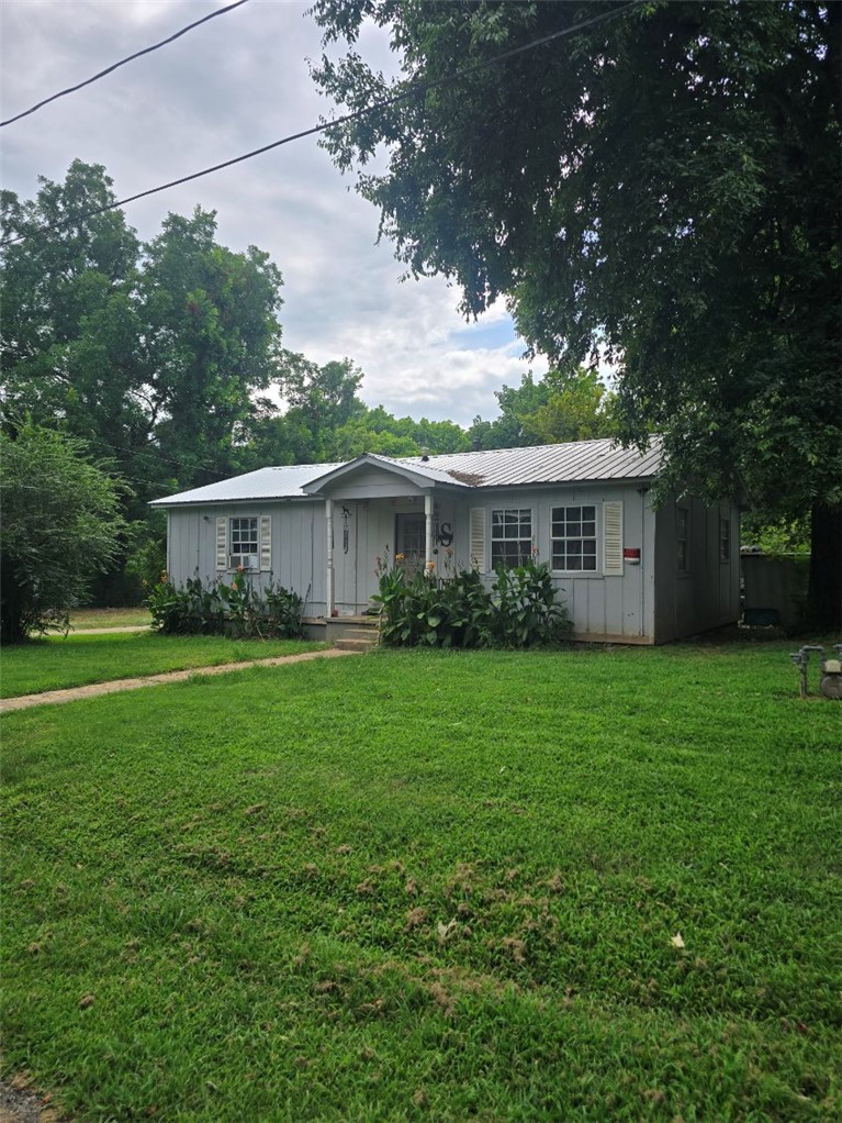 Welcome to this single-story home on a .33 acre lot in a convenient location near parks and schools. Recent updates include a new metal roof (2025), wood siding exterior, an updated bathroom sink, and a new shower surround. The refrigerator conveys, making your move a little easier. Whether you're a first-time homebuyer, downsizing, or looking for an investment property, this home offers comfort, convenience, and great value. Schedule your showing today!