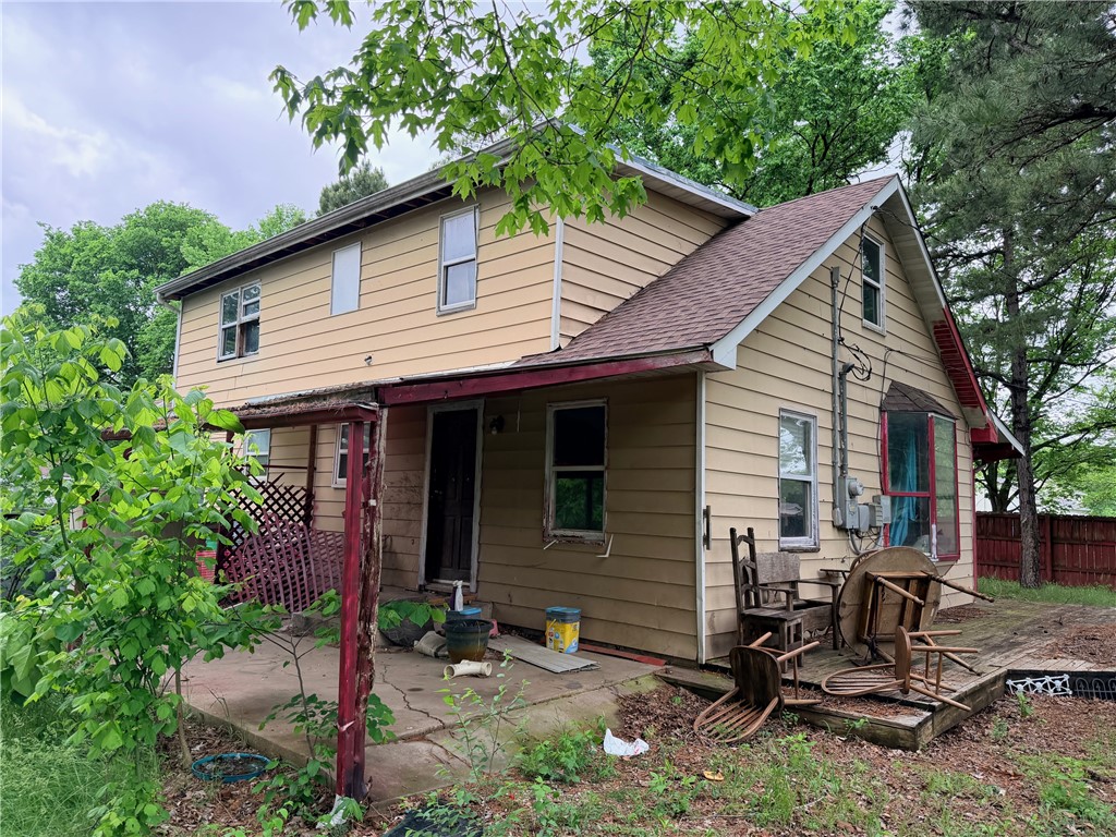 5 bd 2 ba home needs major remodeling.  Partial wood fence on two sides and chain link on one side. Covered front and back porches. Floors appear to be solid. 3 bd 1 ba on main floor and 2 bd 1 ba upstairs. Unfinished walkout basement. Property will not go VA, RD or FHA. Utilities are turned off. Selling AS-IS; numbers are approximate. NO OFFERS ACCEPTED UNTIL 5/26/26.