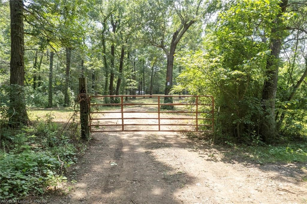 Secluded 3 acres in Kibler area with existing utilities! This property has a level building site ready to build your dream home. This property includes a seasonal creek and approximately 50% wooded. No deed restrictions.