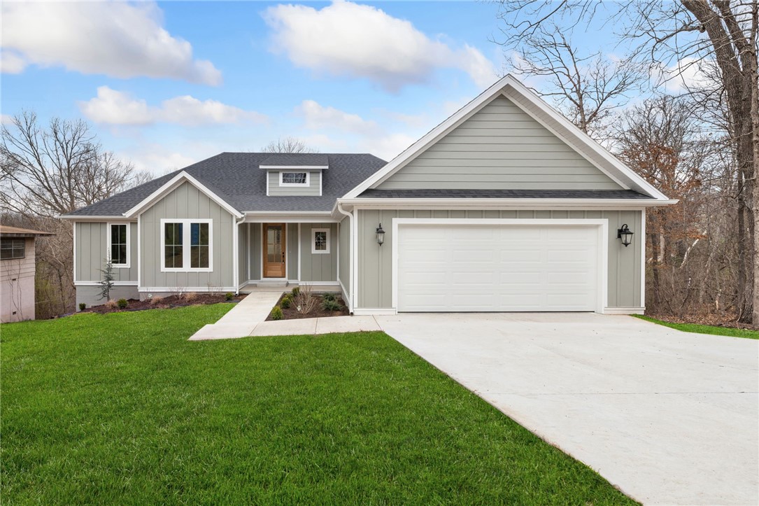$10,000 Price Improvement! This gorgeous new construction home on nearly half an acre lot has a perfect layout both for entertaining and a seamless flow of everyday living. This stunning open floor plan features a split design w/a primary ensuite on one side & and an office with 2 additional bedrooms and on the other side. Upgraded 3cm quartz counters, beautiful hardwoods throughout & tile work add touches of luxury and charm to this home! You will appreciate the custom home finishes that set this spec home apart from others in the area. Come home & kick your shoes off in the mud room, drop your socks into the laundry room, and use the direct access into your primary bedroom to pick out your loungewear. A large walk-in pantry off the kitchen allows tons of storage. The kitchen features soft-close cabinets and drawers that complement the serenity of the space. Only a quick jump to Tanyard Creek, Lake Avalon and 15 minutes to the historic Bentonville square. This one was just completed and ready for its first owners!
