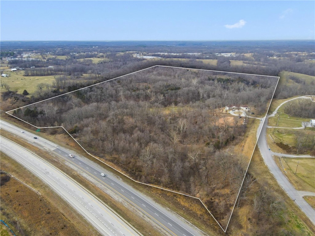 A developers DREAM come TRUE!!! Discover a stunning +-70 acre parcel in Bentonville, Arkansas, offering both commercial and residential potential.  Zoned agricultural, this property features on-site electric and city water utilities and a range of possibilities for development.  Enjoy the natural beauty while envisioning future projects in this prime Northwest Arkansas location.   Walmart just purchased 35 acres for $6mil not too far from this property.   Walmart HO is 7 miles, XNA is 21 miles Property sits right off the highway
Do not wait on this opportunity Call to schedule your tour today
Driving Tours are by appointment only