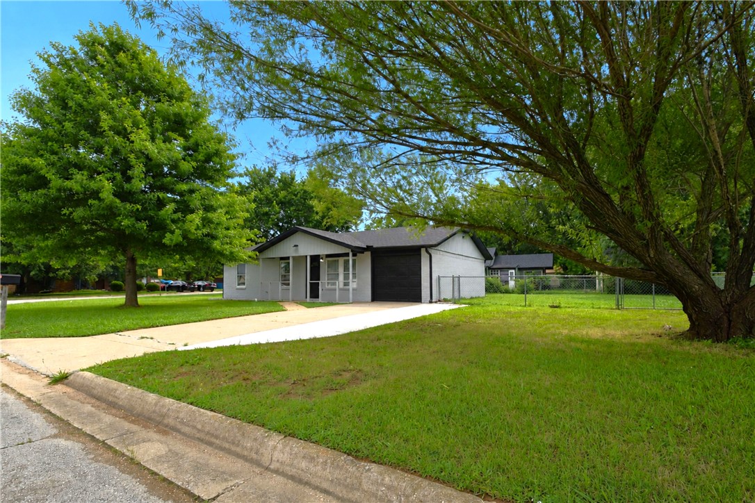 This beautifully remodeled home features a modern, open-concept design just minutes from downtown Rogers. Inside, you'll find gorgeous tile floors and sleek LED lighting features throughout the living room and hallway. The brand-new kitchen is a highlight, completely updated with new cabinets, a pantry, granite countertops, and new appliances. The home offers three comfortable bedrooms and two full bathrooms with great upgrades like tiled showers and lighted mirrors. Outside, the property features a large yard with plenty of space to enjoy. Plus, you are just minutes from the Razorback Greenway trail, world-class mountain bike trails, and everything downtown Rogers has to offer, including the Railyard Park, local shops, great restaurants, and coffee spots.