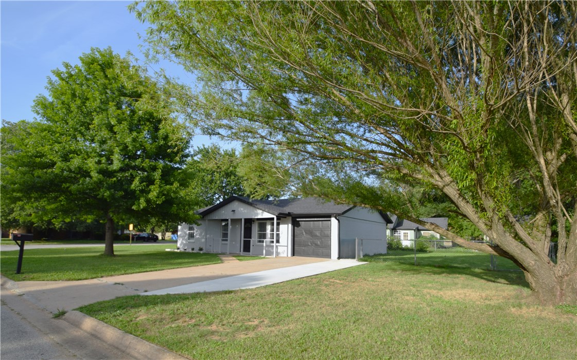 This beautifully remodeled home offers a great blend of modern style and everyday convenience. Located just minutes from downtown Rogers, the house features a bright, open-concept design highlighted by gorgeous tile flooring, a brand-new roof, new HVAC ducting, and sleek LED lighting throughout. The kitchen is a major standout, completely updated with new cabinets, a pantry, granite countertops, and new appliances.  The layout includes three comfortable bedrooms and two full bathrooms, both updated with nice touches like tiled showers and lighted mirrors. Garage has painted floors. Outside, the large yard offers plenty of open space to enjoy. Best of all, you are just minutes from the Razorback Greenway, world-class mountain bike trails, and everything downtown Rogers has to offer—including Railyard Park, local shops, great restaurants, and coffee spots.