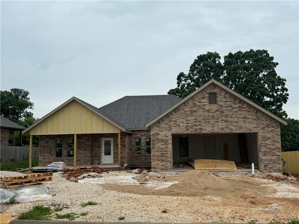 Striking new construction with 3 bedrooms plus an office featuring a modern brick and siding exterior, covered front porch, and clean architectural lines. This home backs up to the POA Green Space. Inside, tall ceilings and expansive windows create a bright, airy atmosphere throughout the open living space. LVP flooring to be installed throughout home - no carpet. Kitchen has stainless appliances including a gas range, and an oversized island accented by stylish pendant lighting. The primary suite offers a peaceful retreat and a spa-inspired bath showcasing a fully tiled walk-in shower. Secondary bedrooms provide flexibility for guests, office, or any other needs. Energy-efficient construction, modern lighting and thoughtful design details throughout. Conveniently located in a growing neighborhood with easy access to parks, schools, and everyday amenities.