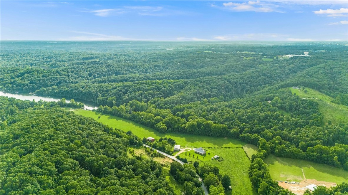 Searching for your place on the Beaver Lake’s shoreline? This prime 30.51 acre property, with a private boat dock including 2 slips, may be your spot. But, there’s more! This property is a functioning farm/pasture graced by magnificent, rolling countryside while offering multiple possible building-sites. It also has a 40x50 shop. The parcel has a completed perc test from about 3 years ago too. Come see this amazing piece of property which boasts beaver shoreline on 3 sides. Realize your dream!