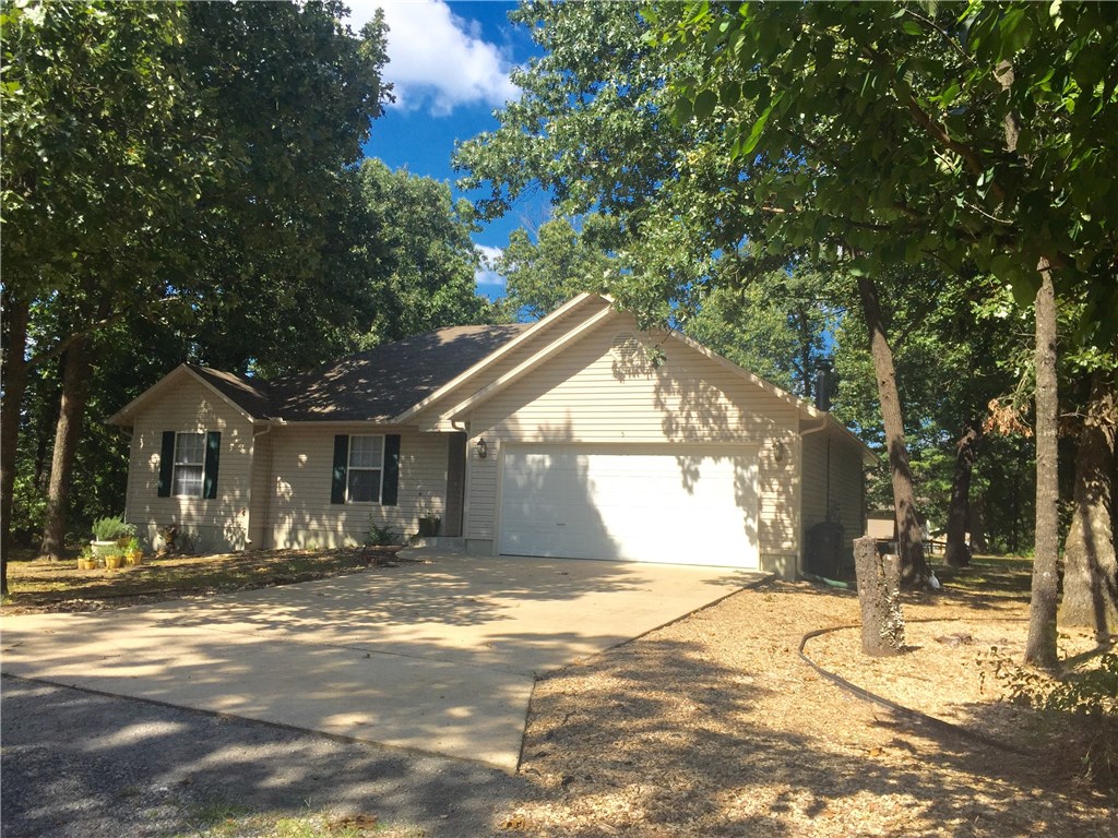 Great Location on Cul-de-sac. Large, level lot. 3 Bedrooms/2 Baths/2 Car garage with work bench/extra storage area. Open Concept. Full Kitchen Stainless Steel Appliances plus Ikea kitchen island. Includes washer/dryer. Patio and Deck area to entertain. Bentonville Schools. Private setting within a Lake Brittney subdivision.
