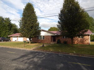 Very nice 3BR, 2BA, brick home on a corner lot, with a fenced back yard, concrete patio, storage building, very large attached 2 car garage/workshop, large office/study between the house and garage, fireplace in the family room open to kitchen/dinning area, large formal living room, CHVAC, new double pane windows installed about 2 years ago, nice metal roof. Call us today to schedule a showing!