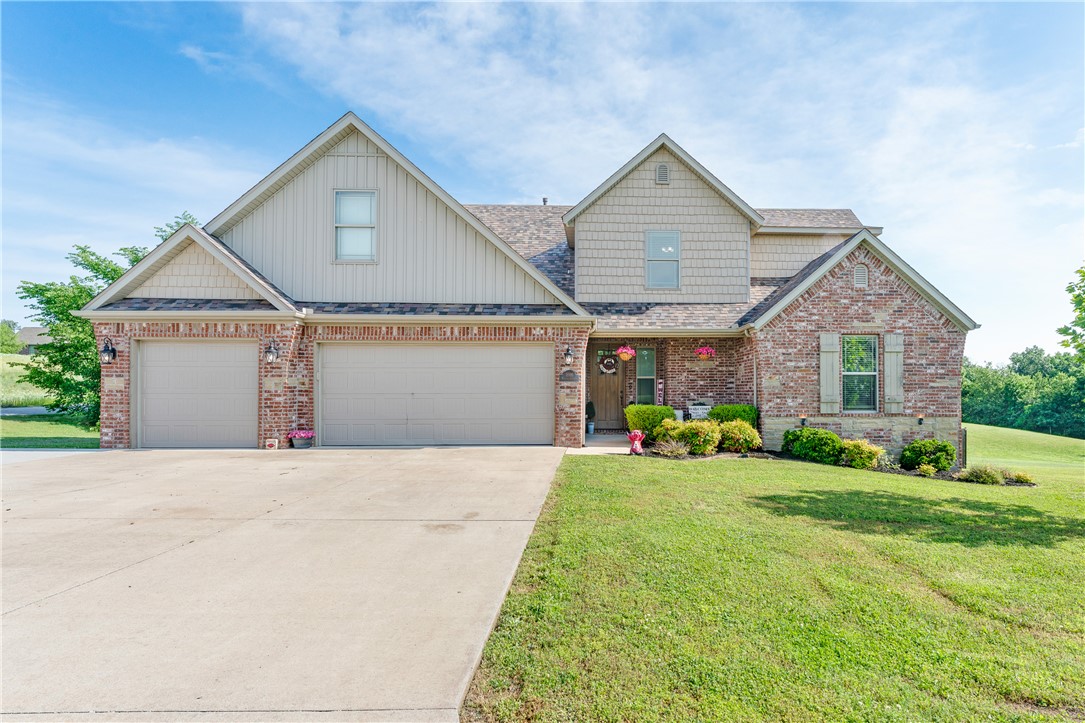 Experience comfortable living and entertaining in this beautifully designed home in Siloam Springs featuring 4 bedrooms, 3 baths, a bonus room, and a backyard retreat with a pool. The main level offers an inviting living area, dining space, and a spacious kitchen with pantry and vaulted ceilings that create a bright and open atmosphere, along with access to the upper deck overlooking the pool and backyard—perfect for relaxing or entertaining. Enjoy a spacious primary suite featuring dual sinks, a jetted tub, walk-in closet, and direct laundry room access, while an additional main-level bedroom and full bath offer flexibility for guests or everyday living. Upstairs includes two more bedrooms and a versatile bonus room perfect for a media space, office, or playroom. Enjoy a beautifully maintained backyard with plenty of room to entertain, unwind by the pool, or enjoy outdoor activities. Located near parks, schools, shopping, and dining, this home combines comfort, space, and convenience in Siloam Springs
