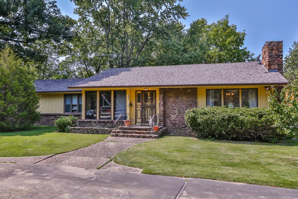 Short 3 block walk to Bentonville Downtown Square! Stroll down to all the amazing community events, no need to worry about finding a parking spot! Directly across from 6.5 acre Compton Gardens! 4 bedrooms, 2 full baths & 2 half baths. Bonus "man cave" with 1/2 bath in finished basement. 2 living areas. Fireplace w/blower & ducts to upper level. Central Vac. New roof 2010. Solid home built by builder as personal residence, just waiting to be updated into a spectacular home in thriving Downtown Bentonville!