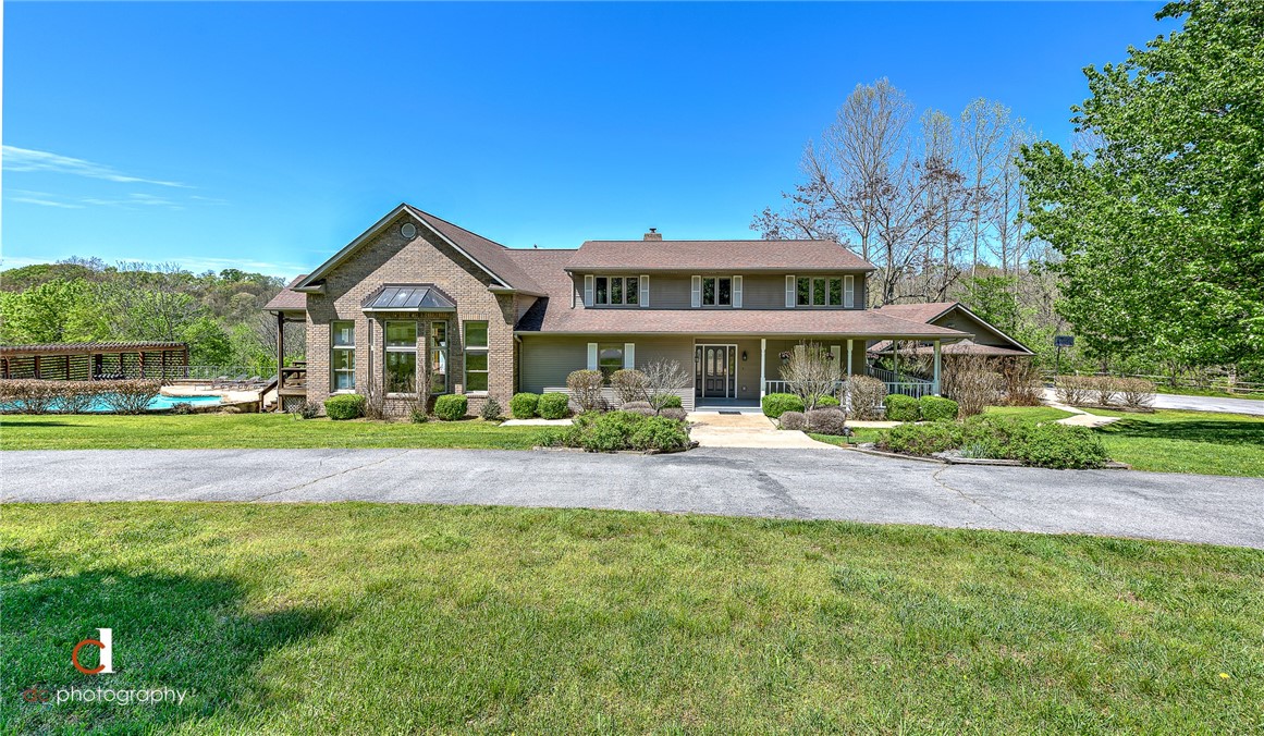 Gorgeous 21+ acres only 5.8 miles from Bentonville Square https://youtu.be/pE3WV6sUeZI. A circular drive welcomes you to beautiful landscaping, 2 car garage plus a detached 30x40 sf shop. Take in spectacular views of the valley and mountains from the abundant large windows throughout.  Watch deer from your back deck or enjoy indoor play in the 805 sf game room with cathedral ceilings, custom cabinets and wet bar. Walk out from the game room to the swimming pool or simply enjoy the hot summer days under the cabana. Graze in your garden or pick fresh apples and peaches from your own orchard. Whether you choose to have horses or prefer to hunt on your own property, you can indulge in a plethora of outdoor activities in your own backyard.